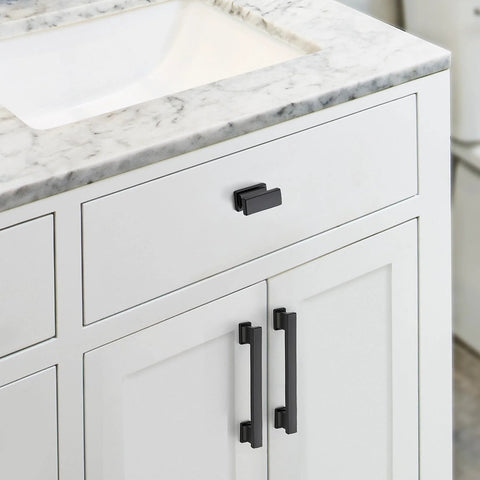 Matte Black Cabinet Knobs Set 10 Pack Durable Zinc Alloy Single Hole Cabinet Handles installed on white kitchen cabinets