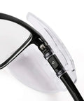 Close-up of glasses with transparent slip-on TPU side shields showing installation. 10 Pack Slip On Eye Glasses Side Shields For Safety Glasses