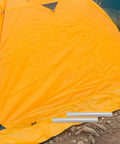 Lightweight Aluminum Tent Pole Repair Tubes 4 Pack Connectors For Easy On The Fly Fix near a yellow tent outdoors