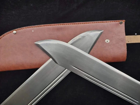Close-up of Bart Cham Dao Damascus Steel Hand Made Sword blades with brown leather sheath for Wing Chun practice and martial arts training.