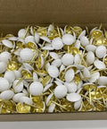 Hella Sturdy White Upholstery Tacks And Decorative Thumbtacks For Sofa Headboards And Furniture Trim With Top Shelf Hardware featuring a box full of white tacks with gold tips.