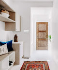 Modern hallway with wooden door, shelving, and Screwless Wall Plate For Decorator Rocker Outlets 4 Gang White Durable cover.