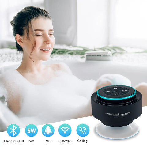 Upgraded Pro Shower Speaker With IPX7 Waterproof Bluetooth Suction Cup Mount Silicone Lanyard 8W Crystal Sound And Rich Bass That Slaps 15 Hours Playtime Compact Waterproof Speaker next to a woman in a bathtub