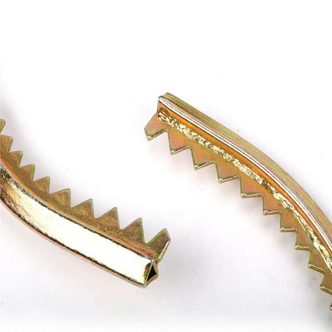 Close-up of metal spikes from Tree Climbing Spikes With Adjustable Straps And Non Slip Pedals, Built Tough Pole Climbing Gear.