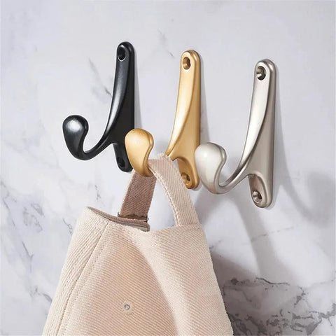 Sleek Wall Mount Coat Rack Built With Rock Solid Zinc Alloy Hooks Perfect For Mudrooms And Halls displaying black, gold, and silver hooks.