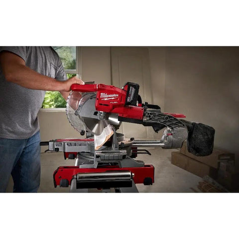 Person using Beast Mode 18 Volt Fuel Lithium Ion Brushless Cordless 10 Inch Dual Bevel Sliding Compound Miter Saw Kit With Free 9Ah Battery.