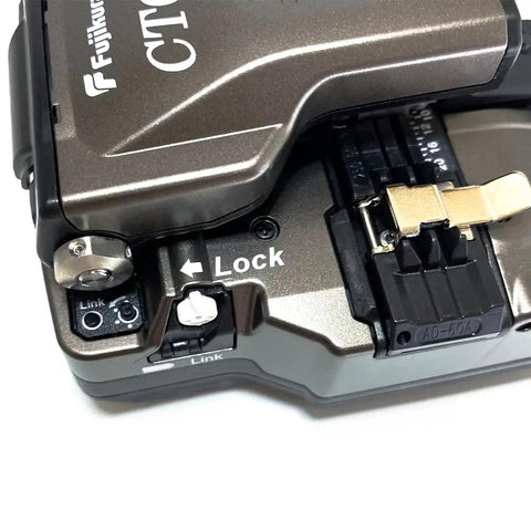 Close-up of CT 60 Fiber Optic Cutter With Auto Bluetooth Connection For Field Use showing lock mechanism and link button.