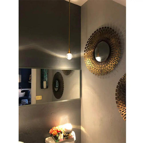 Teardrop Crystal Pendant Light With Gold Brushed Brass Finish One Light Mini LED Fixture Glass Globe Ceiling Pendant in room.