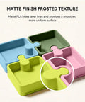 Colorful puzzle-shaped trays showcasing the Olive Green Matte PLA 3D Printer Filament 1.75mm For FDM Printers, Smooth Matte Finish Hides Layer Lines.