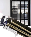 Double Track Sliding Barn Door Hardware Kit For Two Doors With Adjustable Lengths From Four To Ten Feet Built Tough With Heavy Duty Stainless Steel Pulleys And Nylon Wheels For A Smooth Quiet Glide Perfect For Pocket And Bifold Doors Includes A Nine showing track and doors in a home setting.