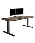 Premium Electric Height Adjustable Standing Desk 72 X 30 Inches With Reclaimed Wood Desktop And Rock Solid Steel Base featuring dual monitors.