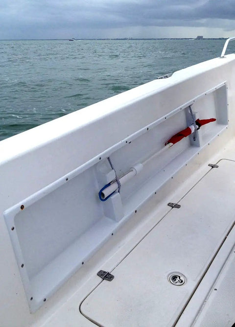 Boat with Saltwater Ready American Flag With Pole for rod holder, secured with bungee and Hook & Loop strap, displayed at sea.