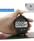 Digital Shore Hardness Durometer And Tester Meter For Rubber Leather Plastic Acrylic Portable Handheld Gauge Dead Nuts Accurate Pocket Powered Measurement Tool Black Edition measuring rubber hardness with clear LCD display.