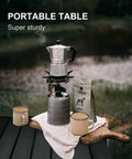 Aluminum camping table with coffee setup, featuring Foldable Aluminum Camping Table, Portable Side Desk for Beach, Hiking, Picnics, and BBQ Cooking, Lightweight, Compact Dining Surface with Carry Bag for Easy Travel and Outdoor Kitchen Use.