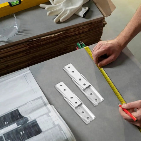 Heavy Duty Hidden Headboard Wall Mount Brackets For Sofa And Couch Sections With Solid Silver Metal Connectors on a measuring table.