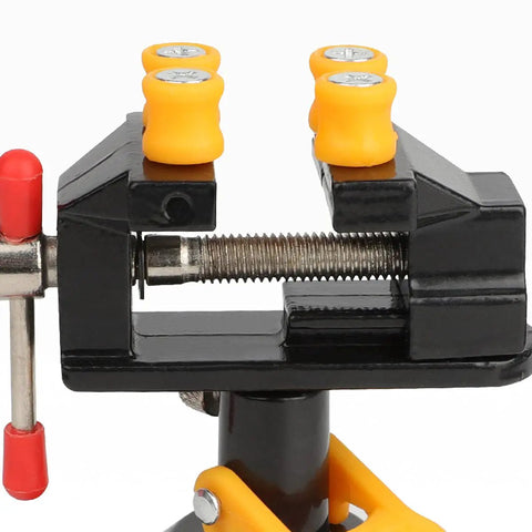 Close-up of Hella Durable Mini Bench Vise With Bombproof Suction Grip and Flawless 360 Degree Swivel Action, showcasing clamping mechanism.