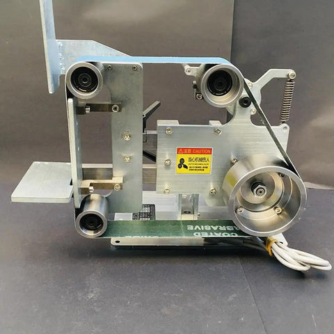Heavy Duty 750W Brushless Belt Grinder A Real Garage Workhorse Built Tough In Rock Solid Steel Frame Forward Reverse Toggle Versatile Benchtop Sander And Polishing Kit from a side view showing motor and frame details.