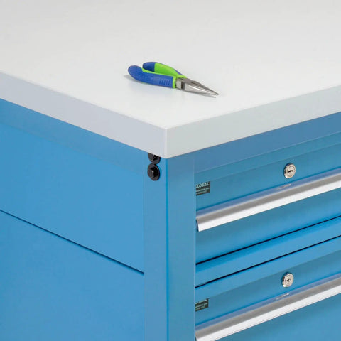Heavy Duty 72 By 36 Inch Workbench With 1 1/4 Inch Thick ESD Laminate Top And Rock Solid Blue Steel Base Featuring Quick Height Adjust Legs For A Massive Five Thousand Pound Garage Capacity showing blue steel drawers and white laminate top with pliers.