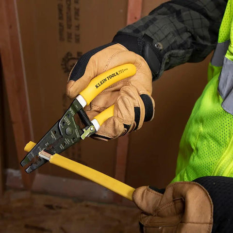 Electrician using Dual NM Cable Stripper And Cutter For 12 And 14 AWG Wire, Strips 12/2 And 14/2 Outer Jacket, precision shear blades