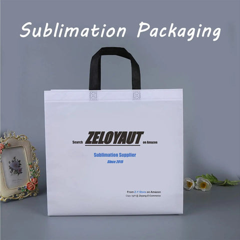 White sublimation packaging bag with black handles and text, framed floral photo and flowers in the background.