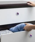 Person using 4 Piece Round Cabinet Knobs Rustic Dresser Hardware With Crystal Glass Surface And 3D Fluid Pattern on drawer