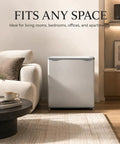 1.1 Cu Ft Compact Mini Freezer Solid Upright Build Slides Right Into Tight Dorm Rooms Or Offices Storing Meats Fresh Fish And Ice With Zero Hassle Cooling Tech next to a couch in a living room.