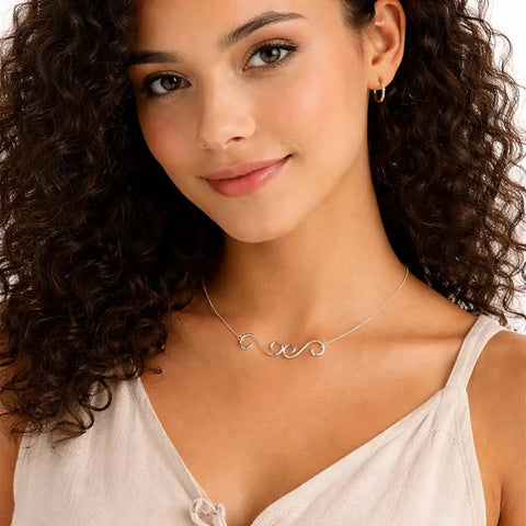 Woman wearing a necklace with silver swirl S-hook connectors, showcasing Set Of 4 S Hook Necklace Extenders With Gold And Silver Swirl Hooks.
