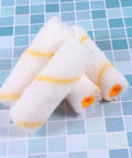 20-Piece Mini Paint Roller Covers Kit Delivers Rock Solid Performance On Drywall Mud And Concrete Surfaces While Your Brush Stays Slick With Zero Drips This Reusable Washable Set Gives You That Pro Smoother Than Silk Finish Every Single Project Run, featuring white roller covers with yellow stripes.