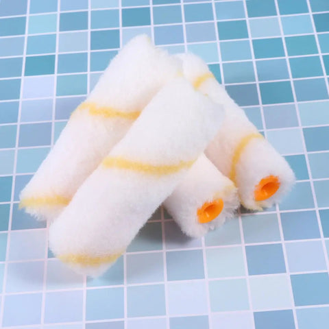 20-Piece Mini Paint Roller Covers Kit Delivers Rock Solid Performance On Drywall Mud And Concrete Surfaces While Your Brush Stays Slick With Zero Drips This Reusable Washable Set Gives You That Pro Smoother Than Silk Finish Every Single Project Run, featuring white roller covers with yellow stripes.