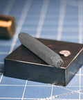 Metal Stamping Tools Set Steel Stamp 0.24 Inch Punch for Imprinting Jewelry Metal featuring heart shape on block.