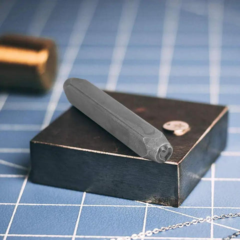 Metal Stamping Tools Set Steel Stamp 0.24 Inch Punch for Imprinting Jewelry Metal featuring heart shape on block.
