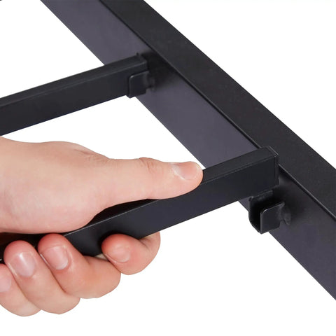 User adjusting the locking mechanism on Heavy Duty Twin Trundle Bed Frame Built Tough For Casual Hangouts And Epic Sleepovers Featuring Roll Out Guest Sleeping Platform Base Zero Sag Steel Slats And Easy Glide Lockable Casters Black.