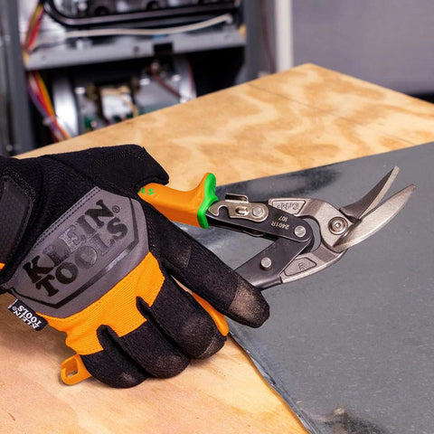 Klein Tools 2401R right-cutting offset tin snips held in orange-black gloved hand