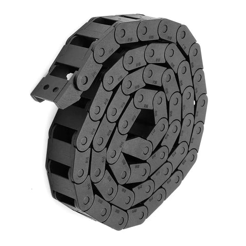 R18 10Mm By 15Mm Black Plastic Cable Wire Carrier Drag Chain 1M Length For CNC Machines, reinforced nylon in coiled arrangement.