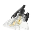 Three Light Bath Vanity Fixture In Black With Dope Industrial Vibe, clear glass shades, side angle view, sleek modern look