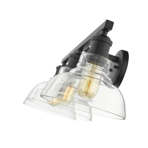 Three Light Bath Vanity Fixture In Black With Dope Industrial Vibe, clear glass shades, side angle view, sleek modern look