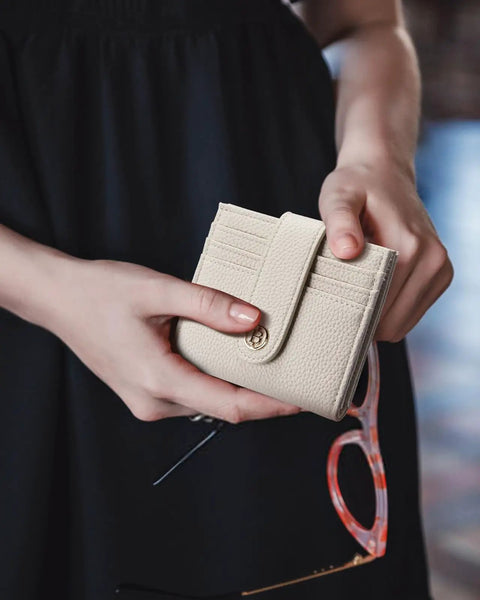 Slim RFID Blocking Wallet For Women, Small Leather Bifold Card Holder With Zipper Coin Pocket, Beige, held in hands