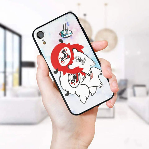 Smartphone with cartoon case design featuring two playful characters in a modern room setting