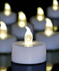 LED Tea Lights With Batteries 24 Pack For Romantic Evenings And Home Decor Long Lasting Flameless Candles close-up showing warm glow