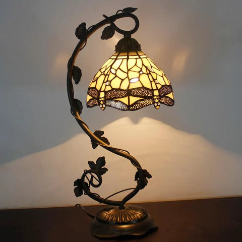 Amber Tiffany Style Dragonfly Table Lamp with Stained Glass Shade and Metal Leaf Base, 21 in tall, bronze finish, lit