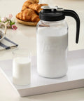 2 Quart Glass Pitcher With Lid Airtight Leakproof Mason Jar Pitcher With Filter Lid Wide Mouth Glass Jar on tray