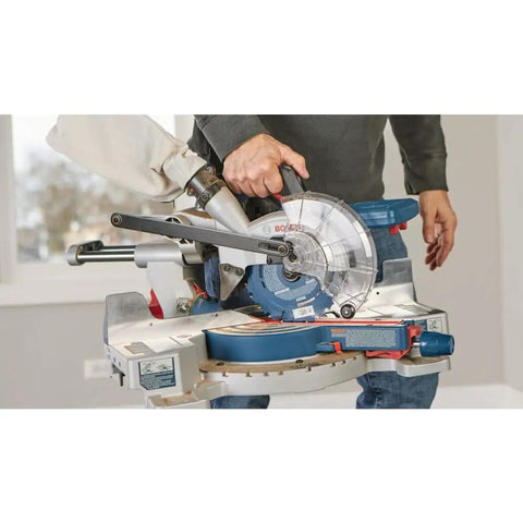 Person using ProFactor Mobile Cordless 18 Volt Sliding Miter Saw With Single Bevel Lightweight On The Go Jobsite Power Seven And A Quarter Inch Nested Crown Cut Eight And A Quarter Inch Crosscut Capacity Three And Three Quarters Inch Crown Cut Bare Tool indoors