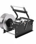 Velorantia Automatic Bottle Labeling Machine For Round Pet Glass Containers With Handle Compact Design For Small Business Use Adjustable Clamps Fits Wide Range Of Label Sizes And Bottles Easy Setup, side angle view.