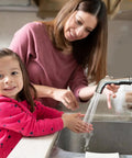 Child and parent washing hands using Universal Kitchen Sink Sprayer Replacement With Hose And Holder, Pull Out Spray Head In Brushed Nickel