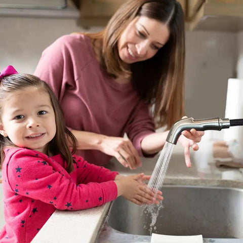 Child and parent washing hands using Universal Kitchen Sink Sprayer Replacement With Hose And Holder, Pull Out Spray Head In Brushed Nickel