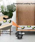 Leveling Stem Casters For Workbenches Heavy Duty 360 Degree Swivel Wheels With Upgraded Ergonomic Handle And Ratchet Arm For Easy Height Adjustment Self Leveling 4 Pack 2200 LBS Capacity shown adjusting cabinet balance with level tool.