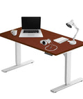 Smooth Electric Adjustable Standing Desk For Home Office Crafted With Heavy Duty Steel Frame with laptop and accessories.