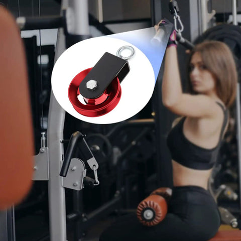 Heavy Duty Lightweight Aluminum Cable Pulleys With Hanging Strap Kit Red 2 Pack For Home Gyms Lat Pulley System Snatch Block Wheel Quiet Bearings Smooth Glide DIY Attachment in use during a workout.