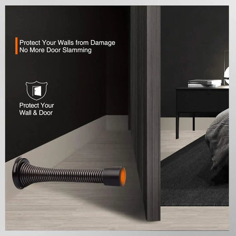 Two Pack Premium Spring Door Stoppers In Glossy Oil Rubbed Bronze Featuring Flexible Black Rubber Pads To Protect Drywall And Solid Doors Totally Effortless Setup For Quick Apartment Upgrades That Seriously Deliver set up beside a door in a modern room.