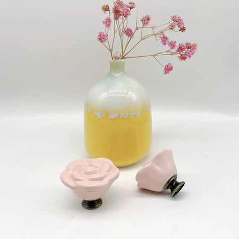 Grab This Dope 10 Piece Set Of Pink Rose Porcelain Cabinet Knobs Perfect For Dressing Up Drawers And Dressers. 1.4 Inch ceramic rose knobs in pink with brass screws.